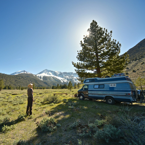 beautiful-shot-female-standing-grassy-field-near-van-with-mountain_3809_3809.jpg