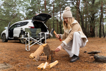 woman-chopping-wood-with-axe-bonfire.jpg